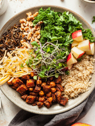 Vegetarian Autumn Grain Bowl with a linen napkin and a fork