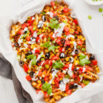 a tray full of loaded air fryer waffle fries