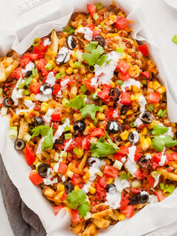 a tray full of loaded air fryer waffle fries