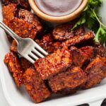 slices of bbq tempeh on a fork