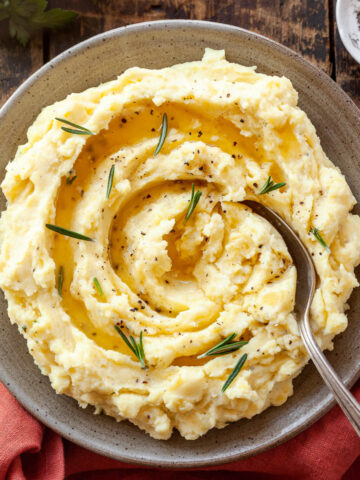 boursin mashed potatoes with a spoon sticking out