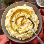 boursin mashed potatoes with a spoon sticking out