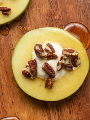 A close up image of apple honey goat cheese appetizer.