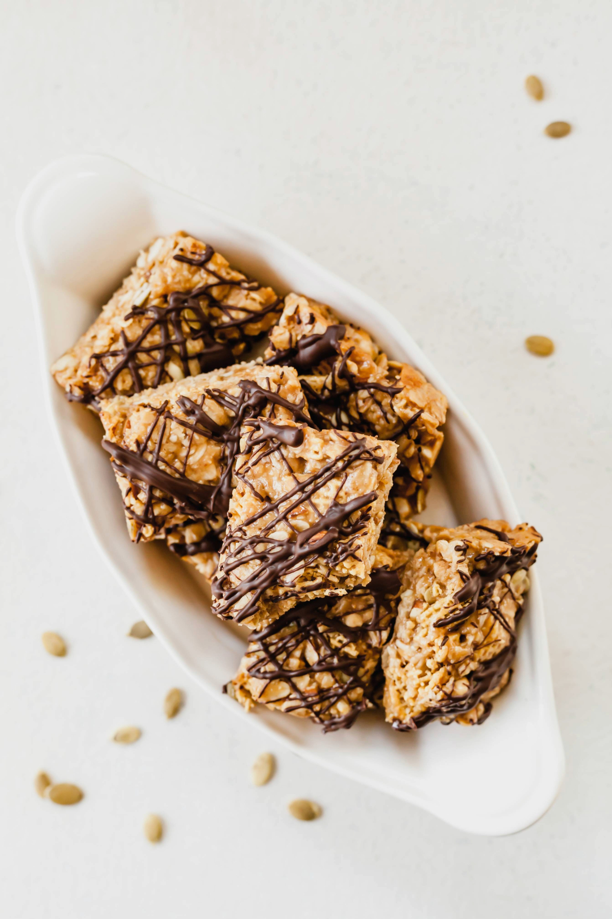 Healthy peanut butter breakfast bars in a small oval dish.