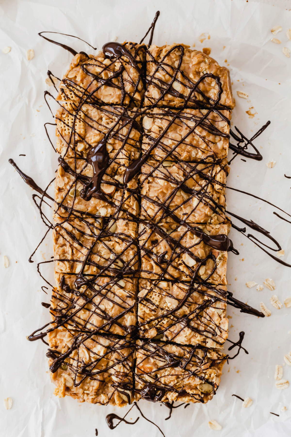 Healthy peanut butter breakfast bars on a sheet of parchment paper.