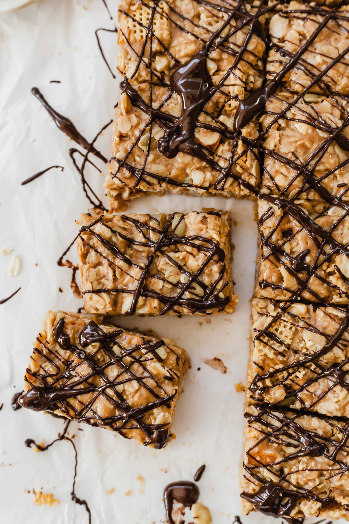 Healthy peanut butter breakfast bars on a sheet of parchment paper.