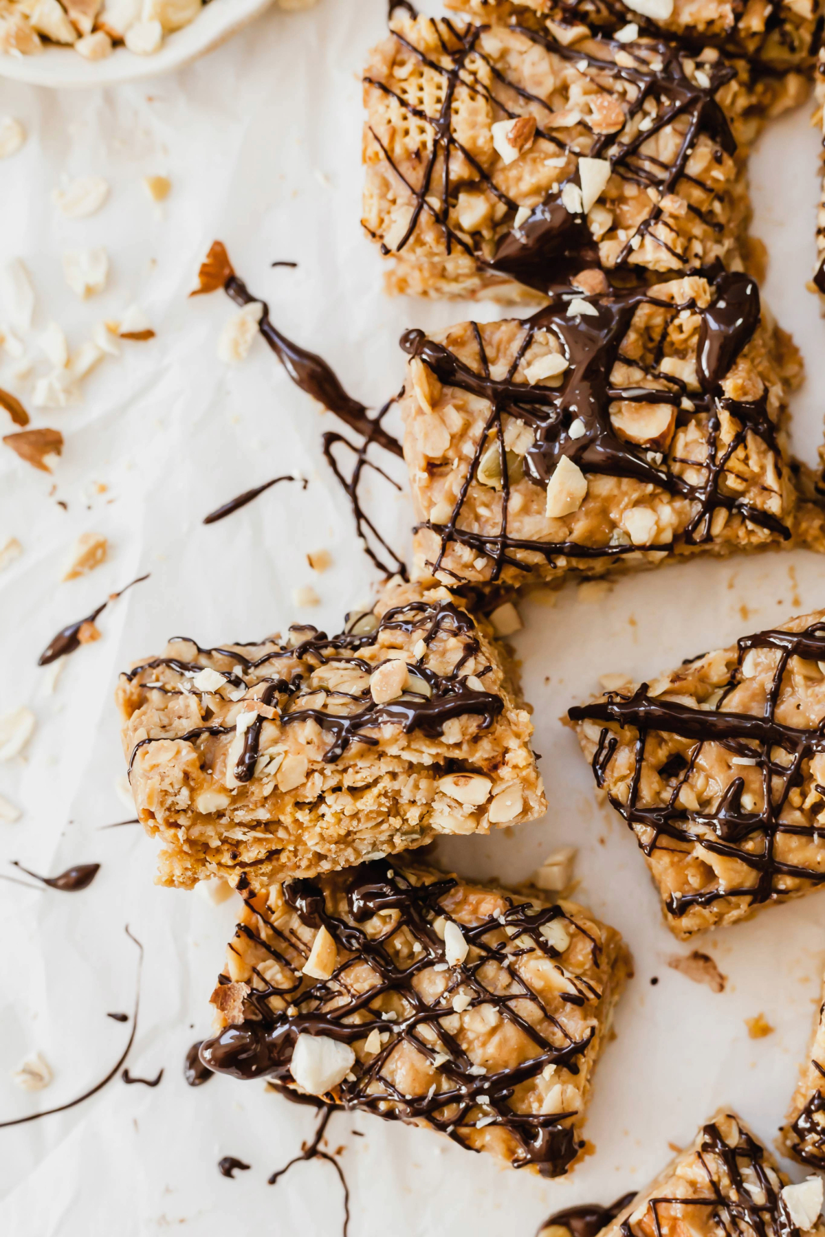Healthy peanut butter breakfast bars on a sheet of parchment paper.