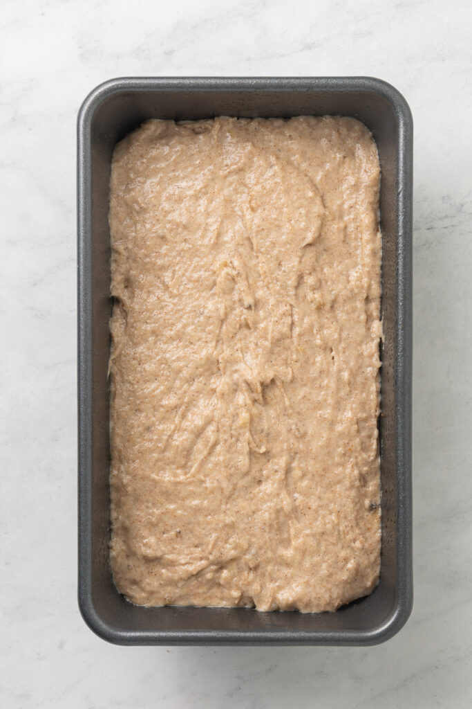Cinnamon swirl banana bread batter in a loaf pan.