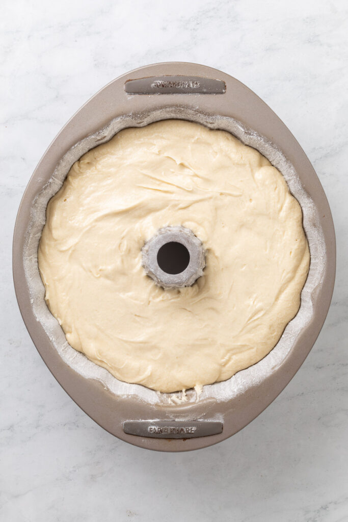 Lemon pound cake batter in a bundt pan.