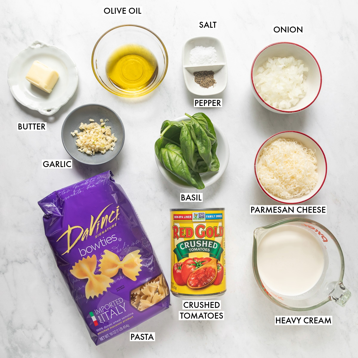 Ingredients used to make tomato alfredo pasta.