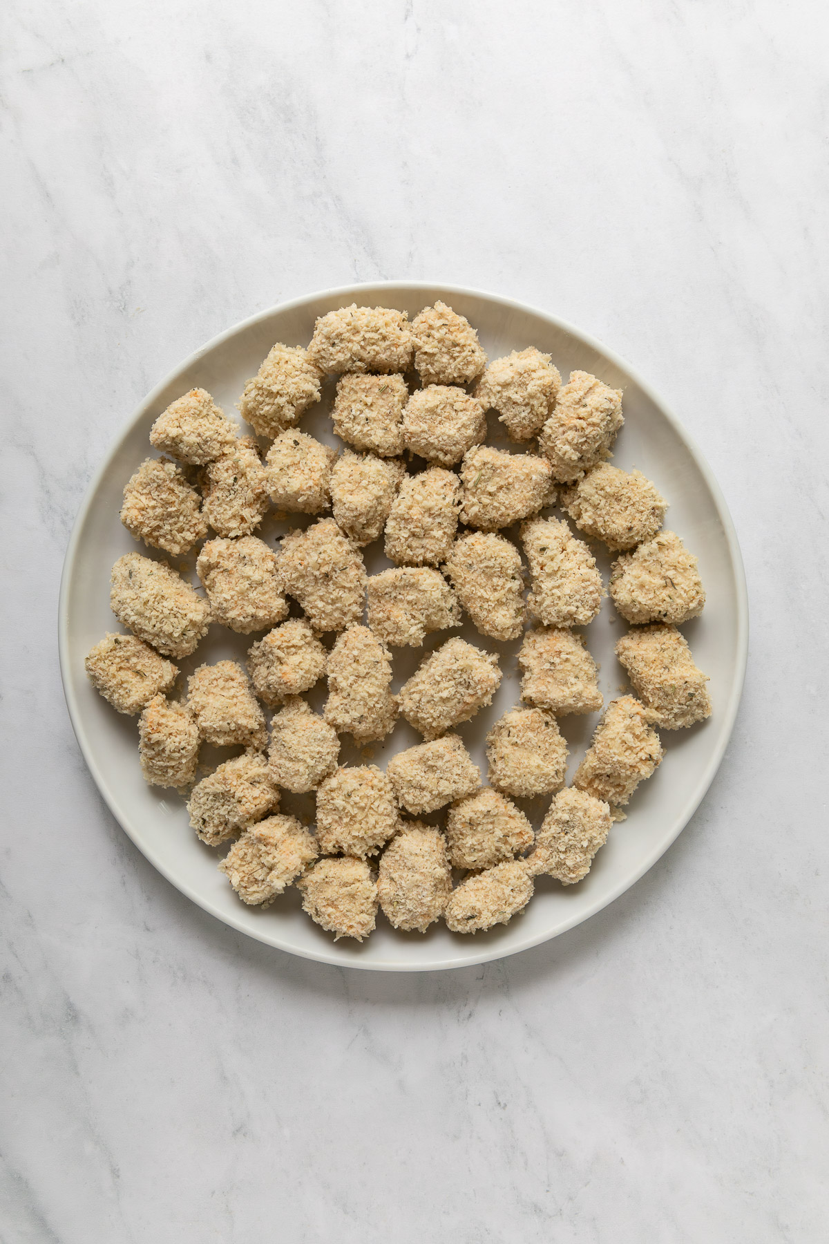Coated tofu nuggets in a bowl.
