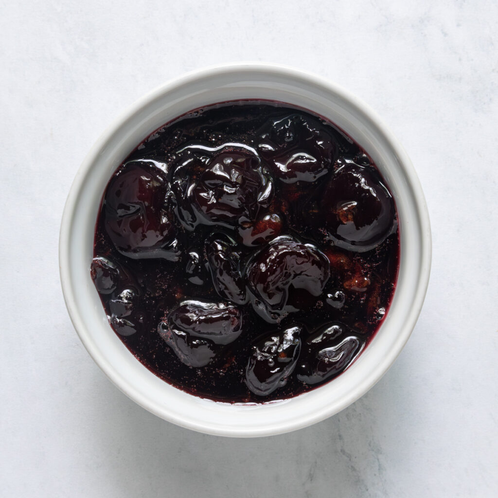 A bowl of roasted cherries.