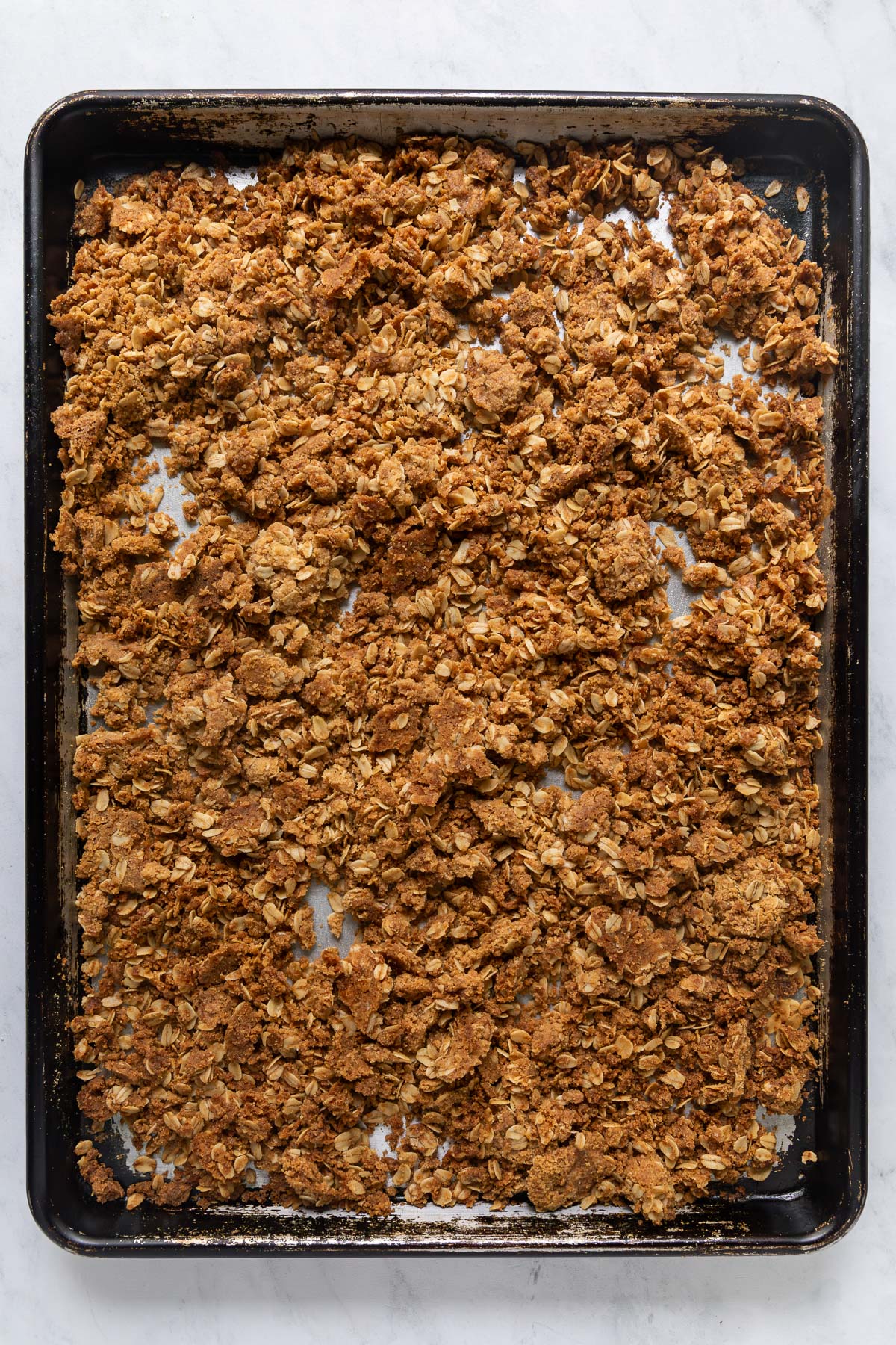 Oat streusel on a baking sheet.