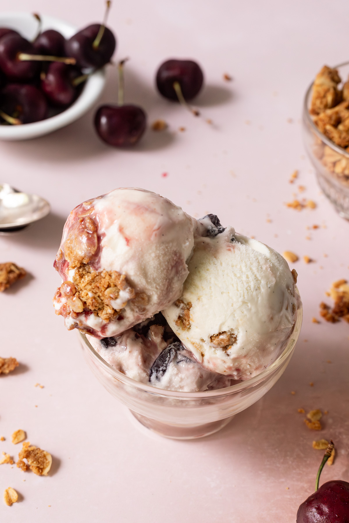 Three scoops of cherry crisp ice cream in a dish.