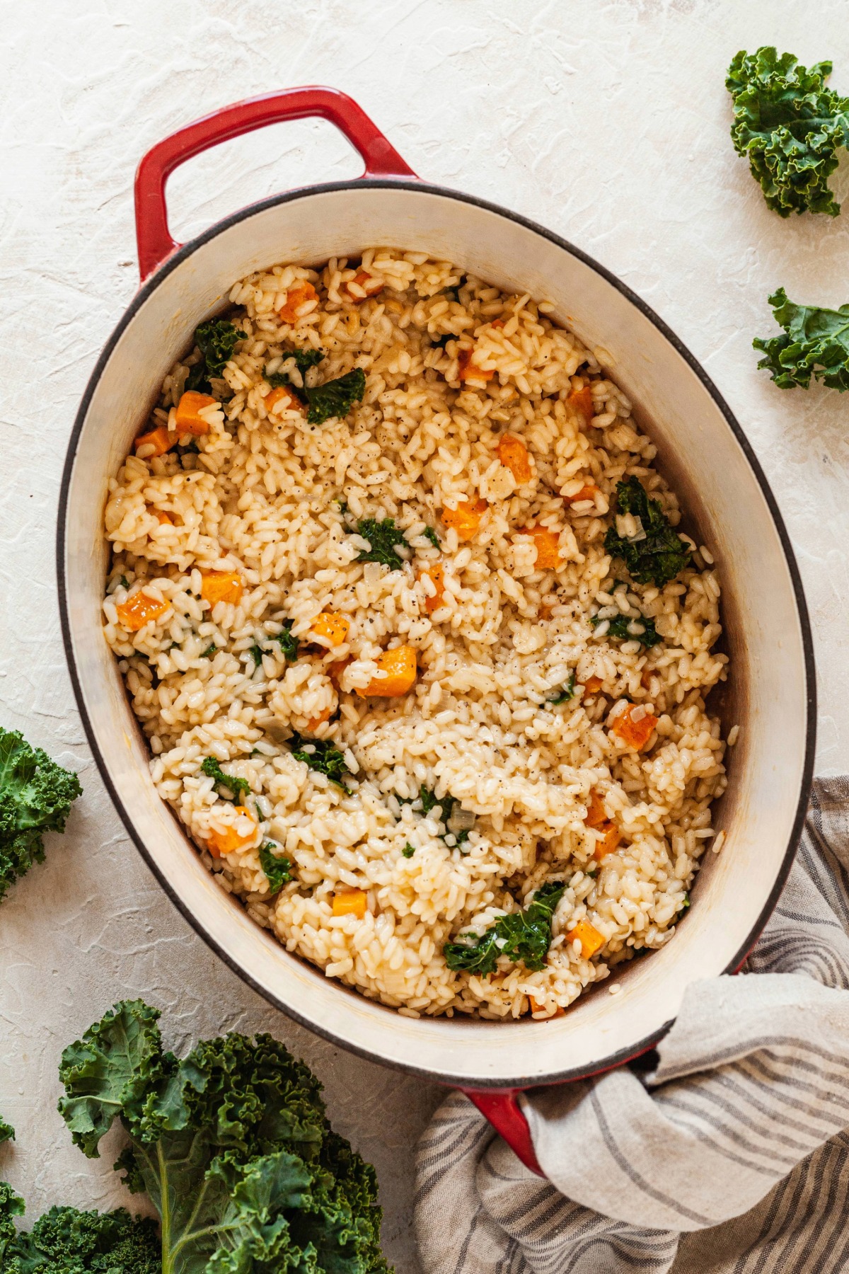 Butternut squash and kale risotto in a dutch oven.