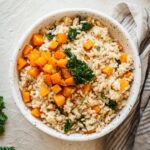 A bowl of butternut squash and kale risotto.