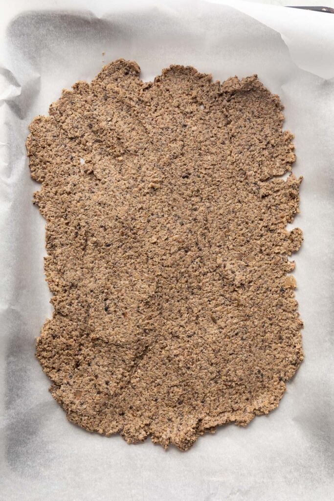 Uncooked meatless crumble on a sheet pan.