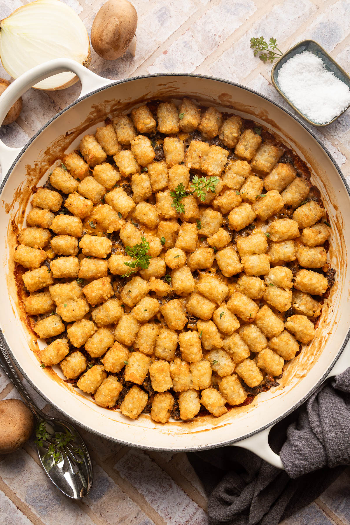 Tater tot casserole in a braiser.