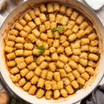 Tater tot casserole in a braiser.