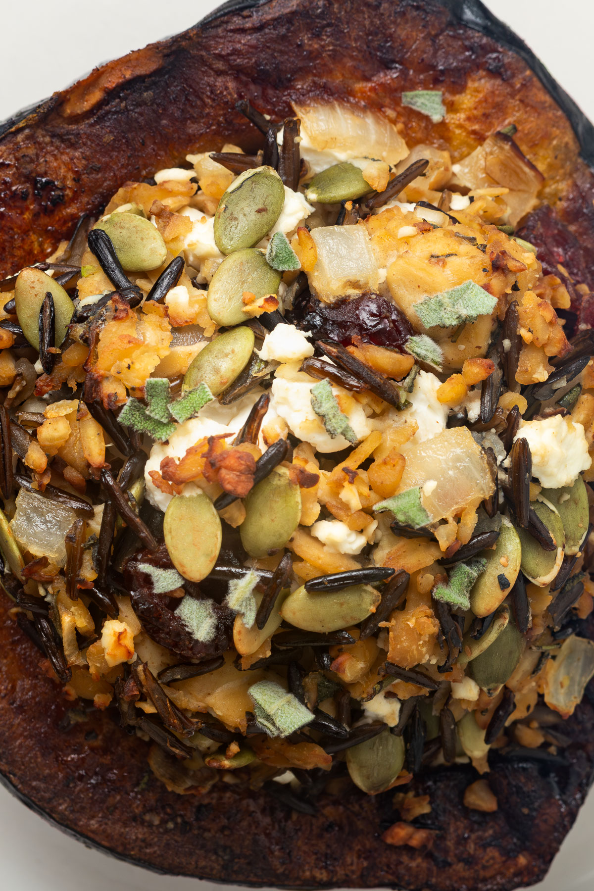 Close up of a stuffed acorn squash.