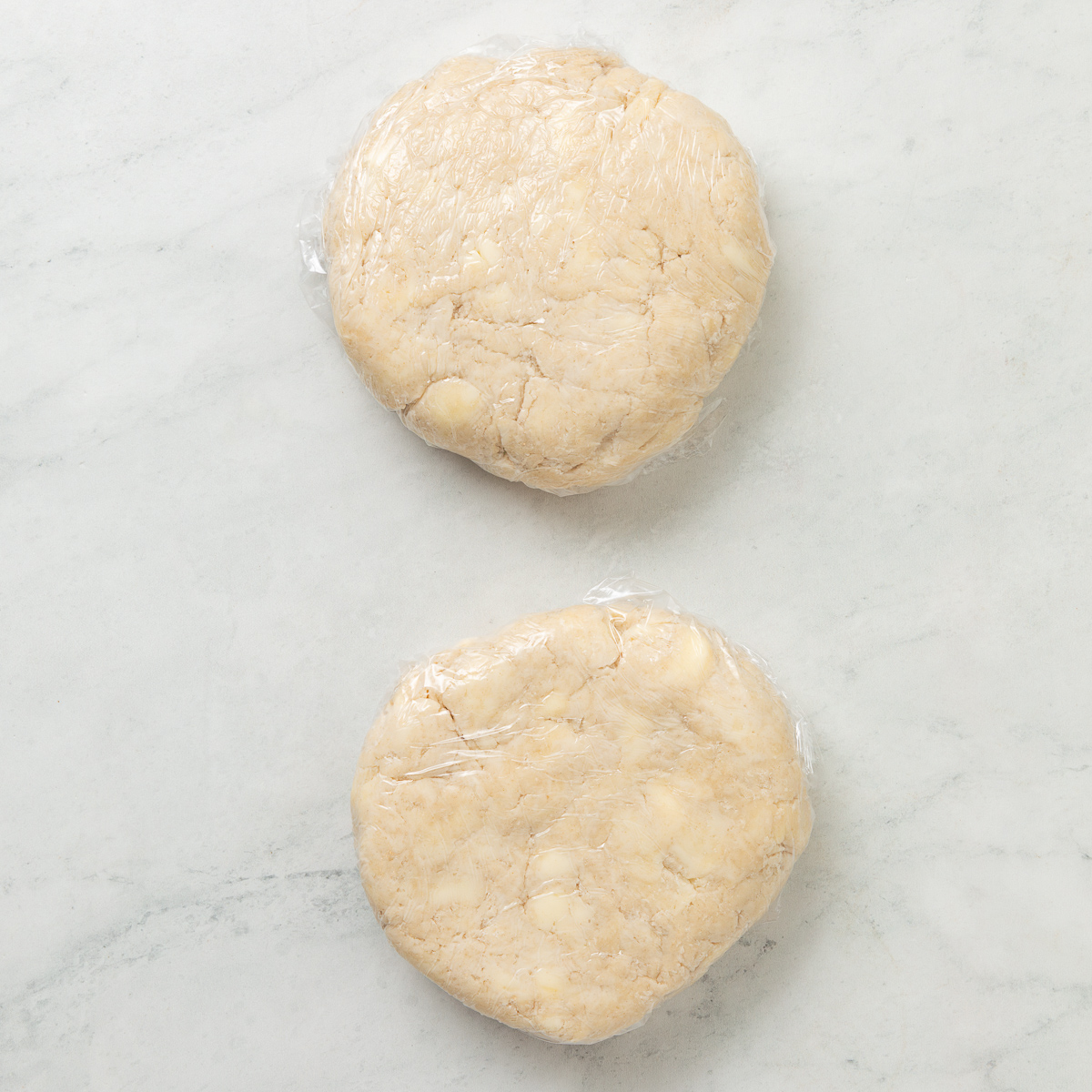 pie crust formed into two discs and wrapped in plastic wrap.