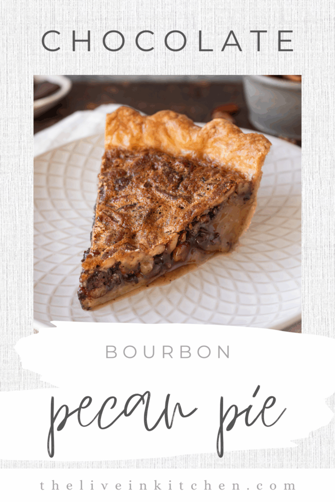 a slice of chocolate bourbon pecan pie on a small plate.
