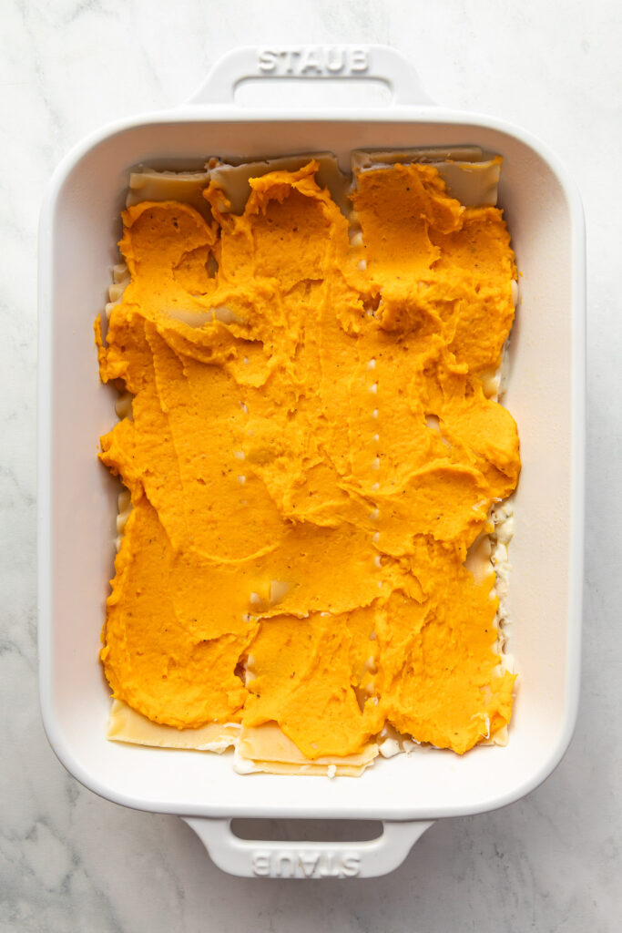 In progress shot of layers of a butternut squash lasagna.