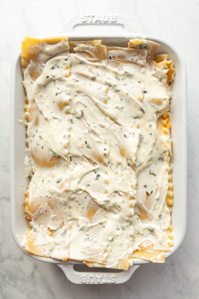 In progress shot of layers of a butternut squash lasagna.