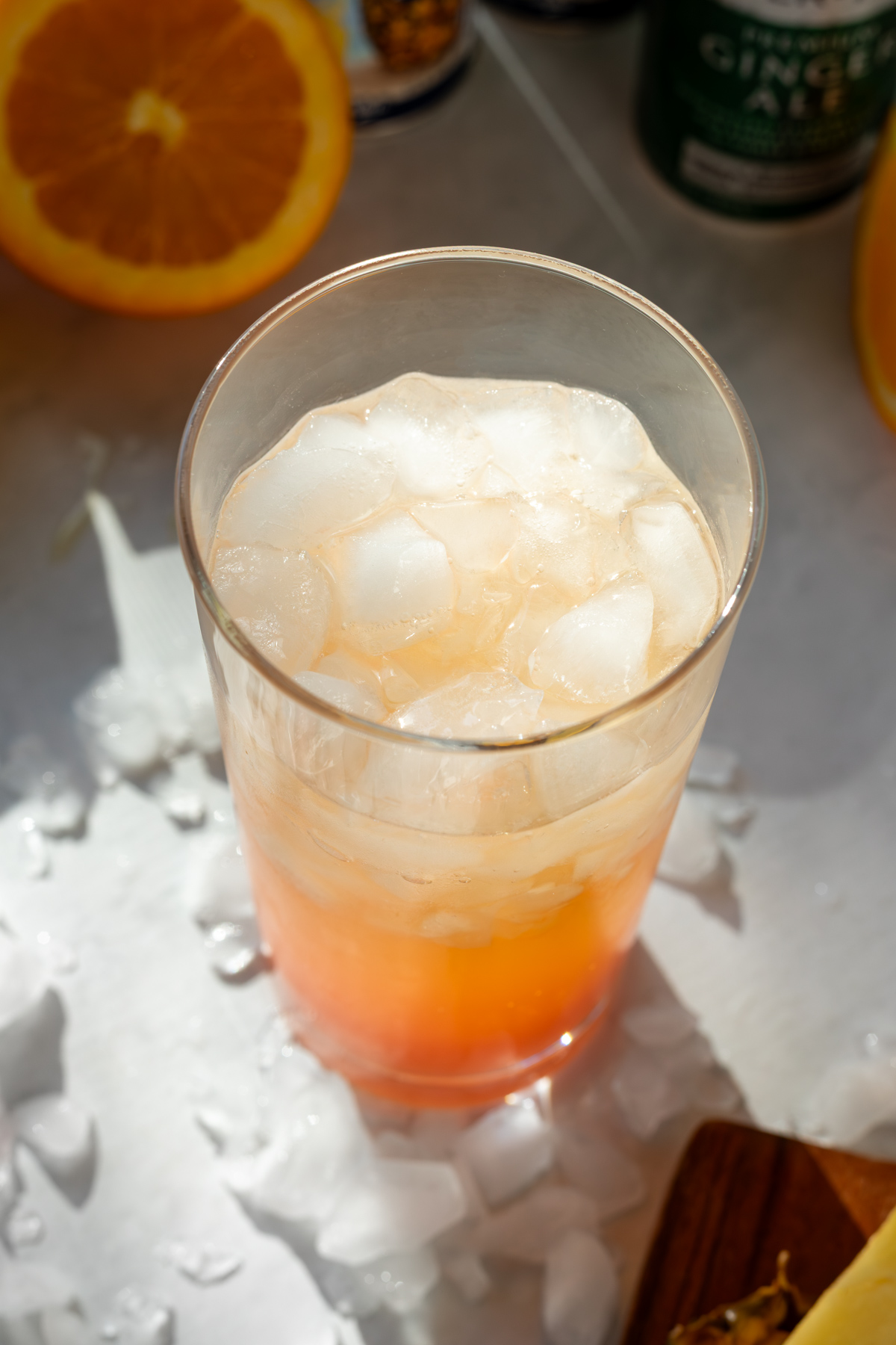 Cinderella mocktail in a glass surrounded by crushed ice.