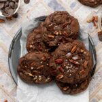 A platter full of double chocolate chip cookies.