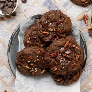 A platter full of double chocolate chip cookies.