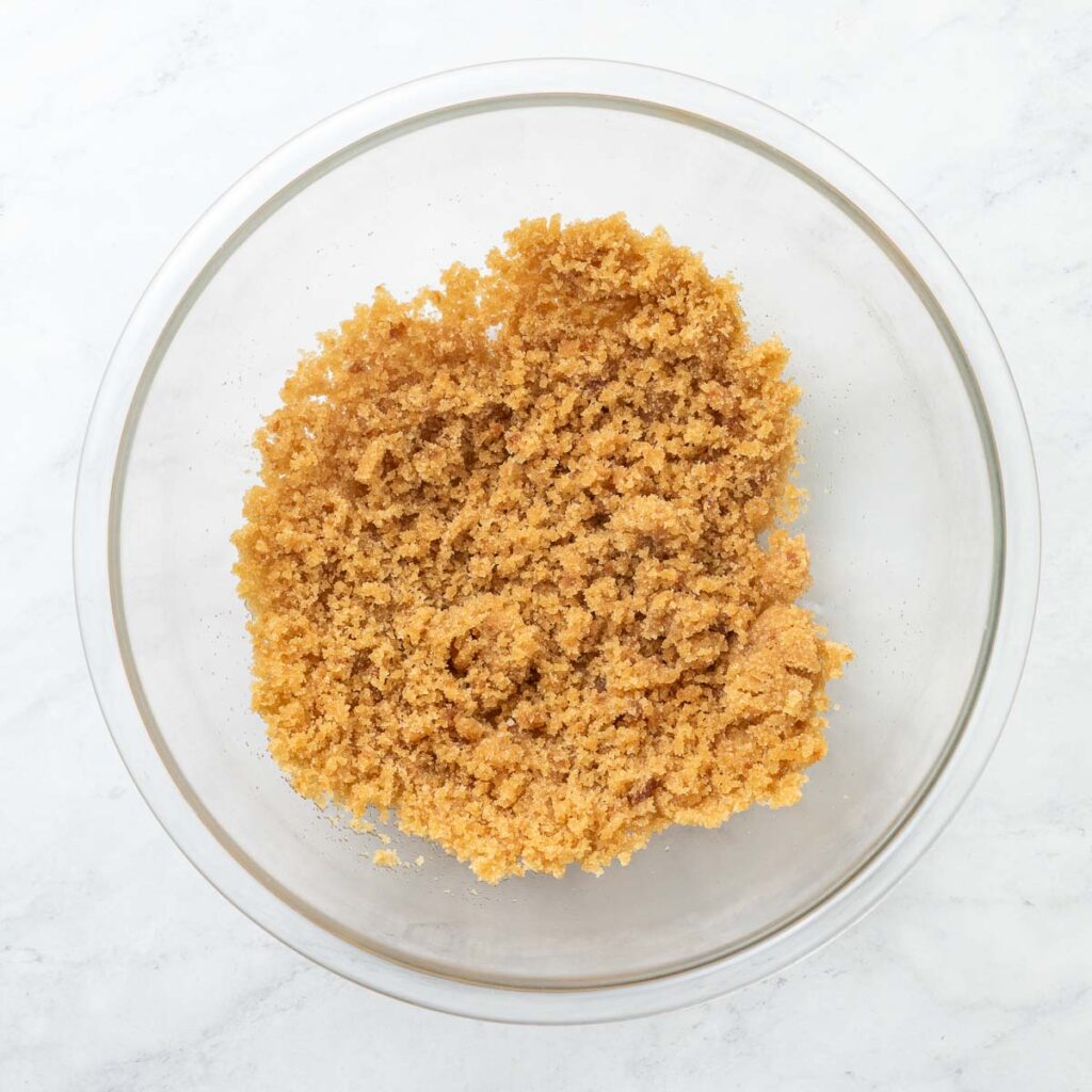 Sugar, brown sugar, butter, and molasses in a mixing bowl.
