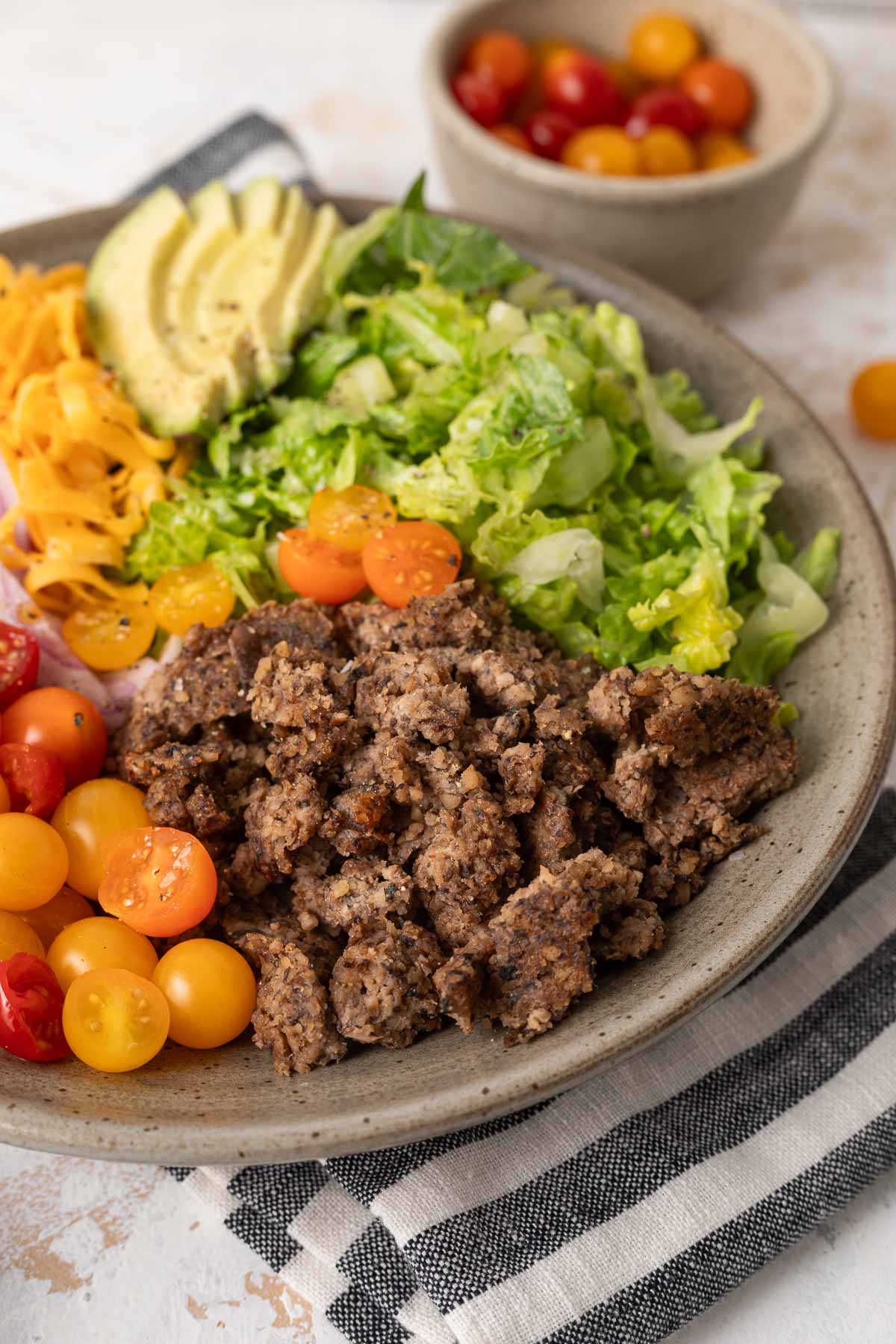 A close up of a vegetarian big mac salad.